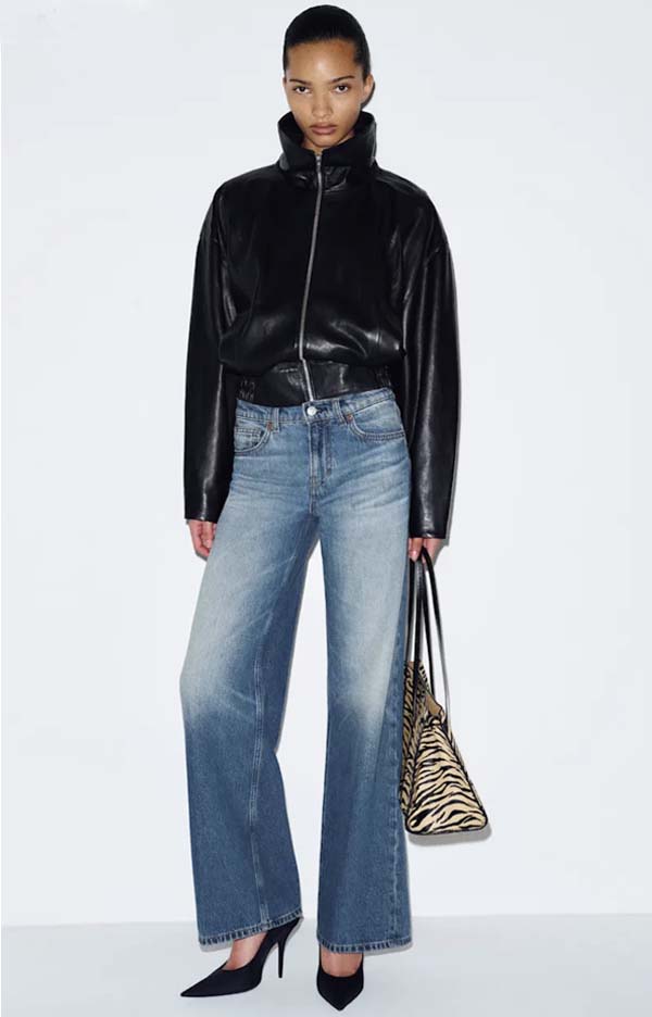 Cropped leather bomber jacket styled with jeans and pumps