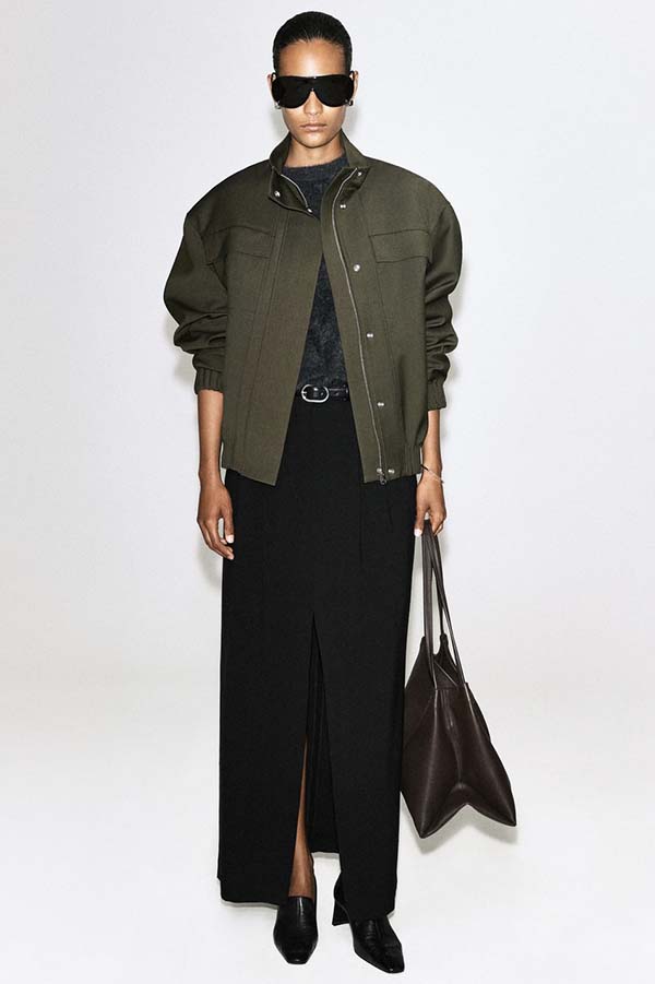 Olive green wool bomber jacket styled with a long maxi skirt